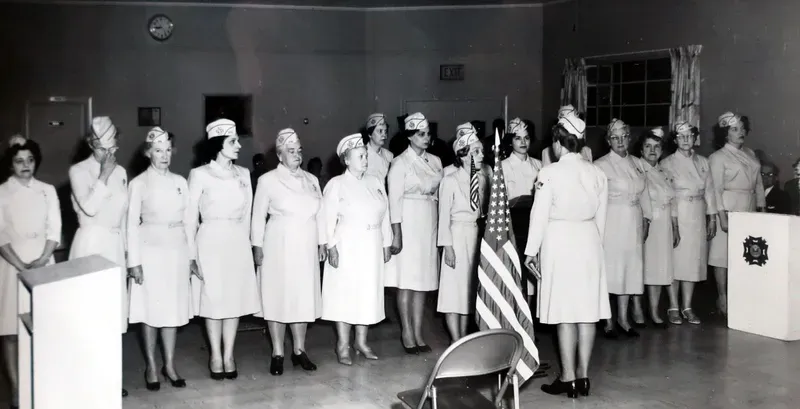 A black and white photo of a group of nurses