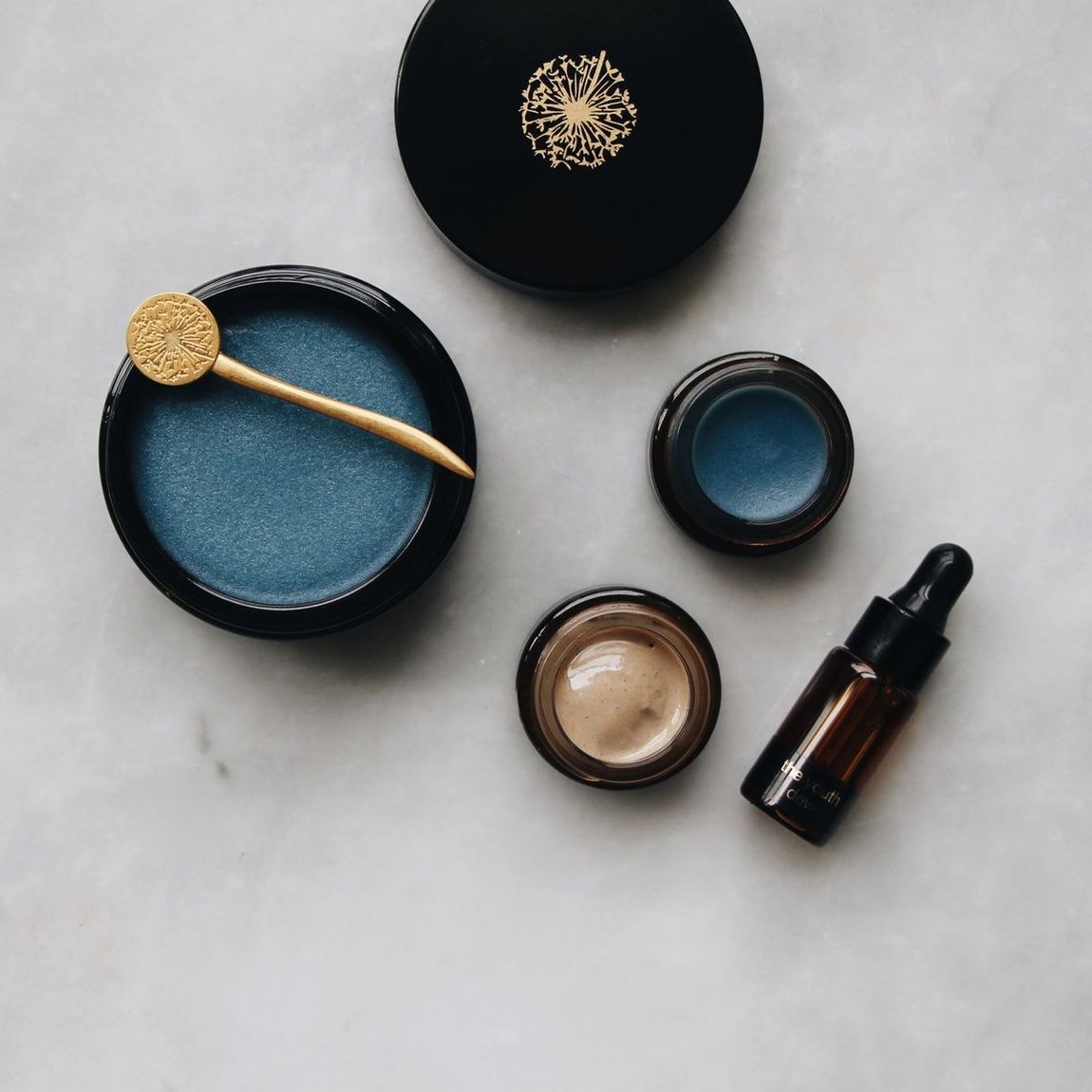 A woman is applying lotion to her back.