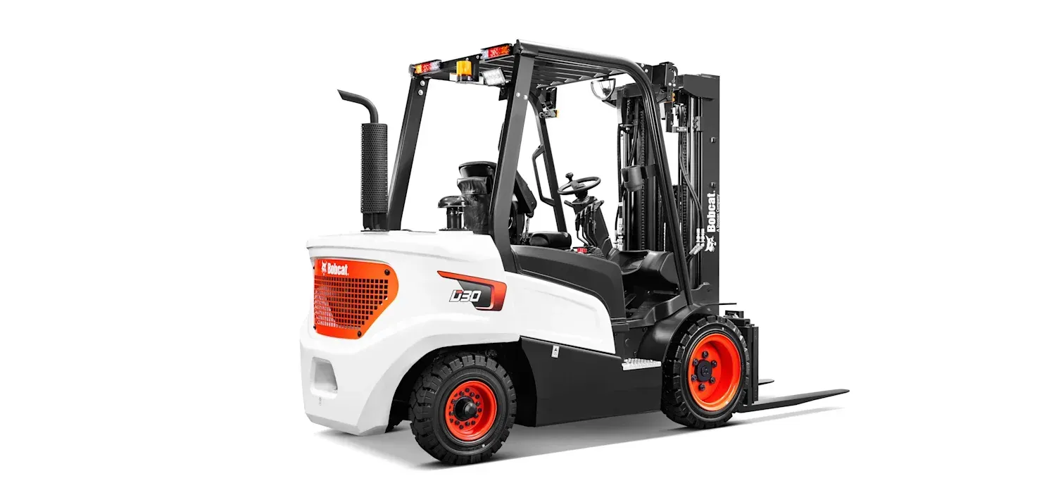 A forklift is sitting on a white surface.