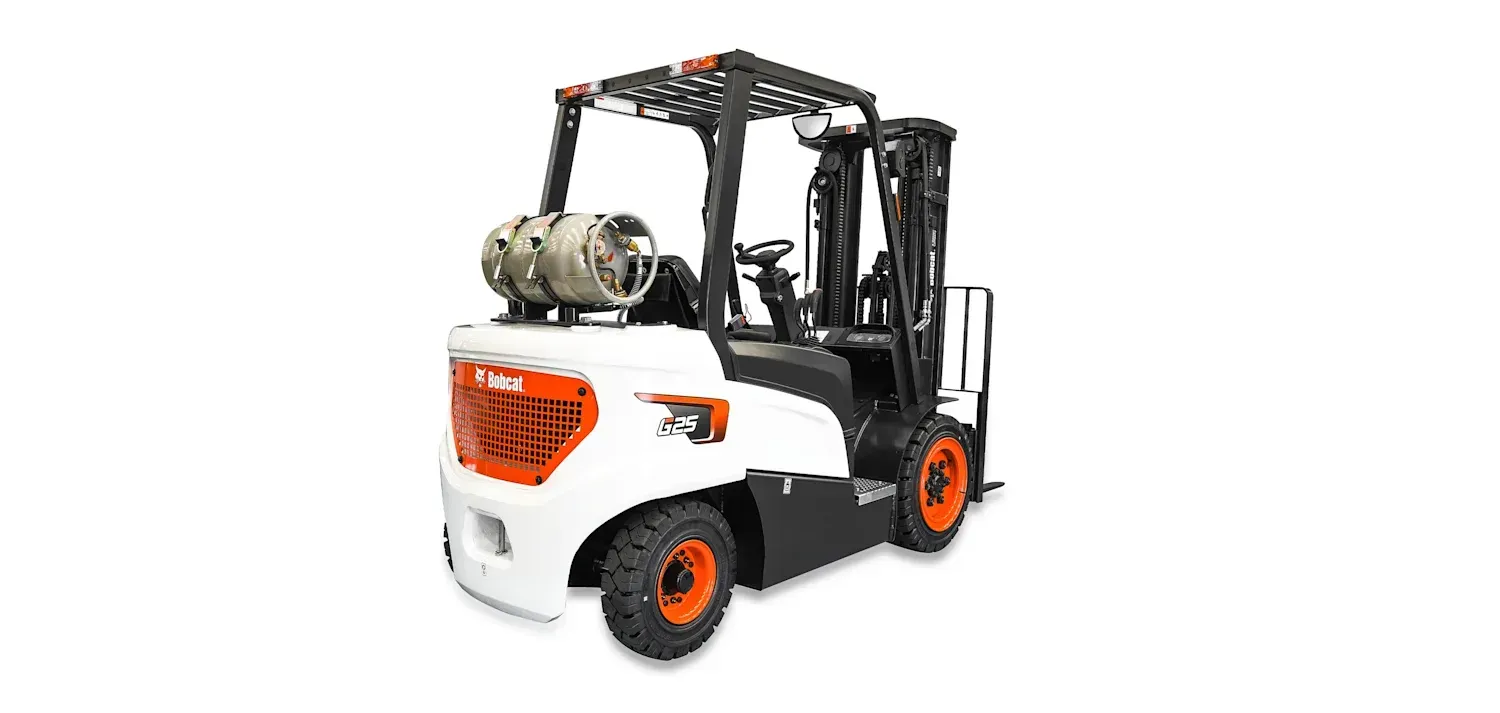 A forklift is sitting on top of a white surface.
