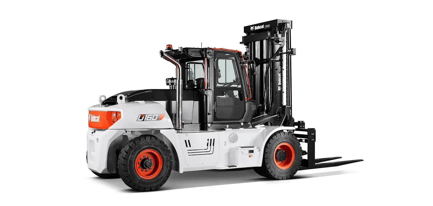 A forklift is sitting on a white surface.