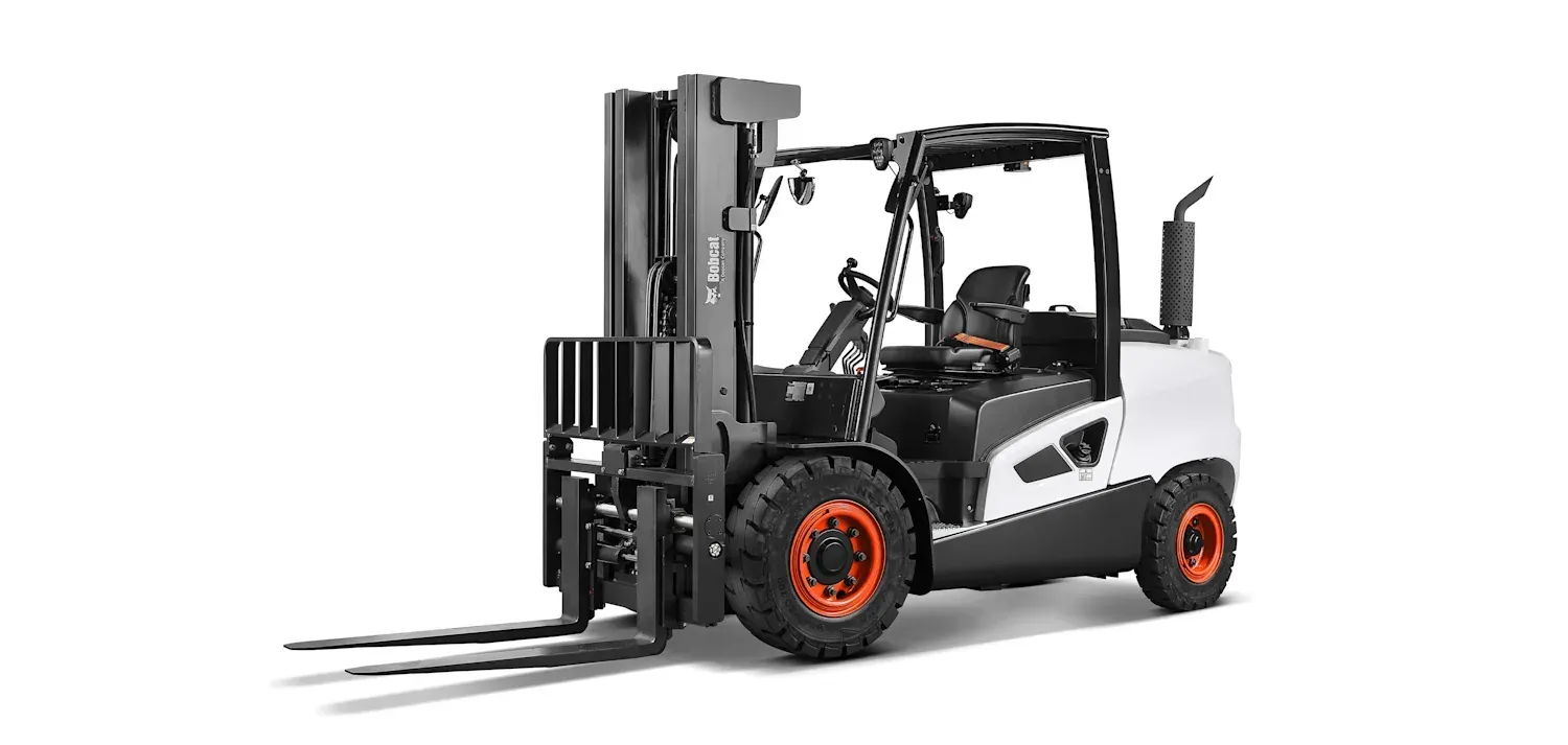 A forklift is sitting on a white surface.
