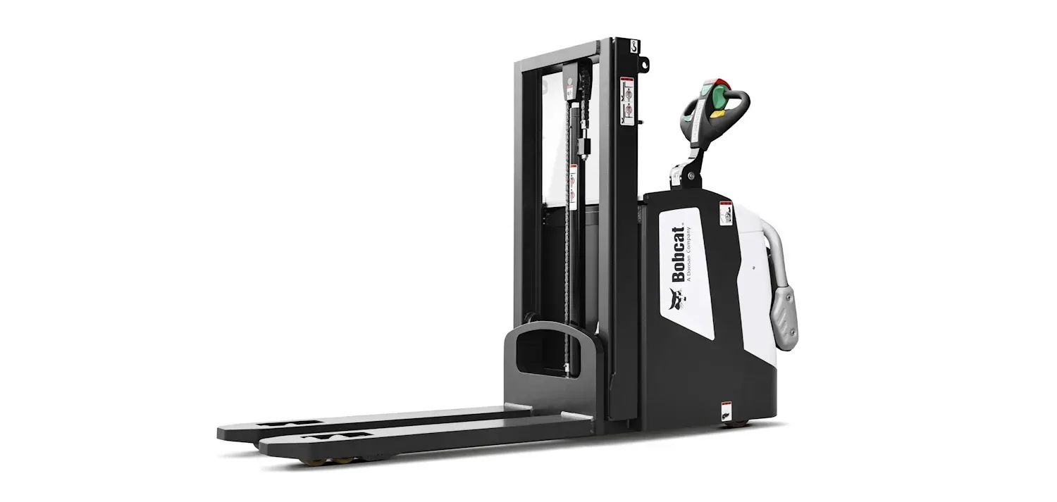 A black and white forklift is sitting on a white surface.