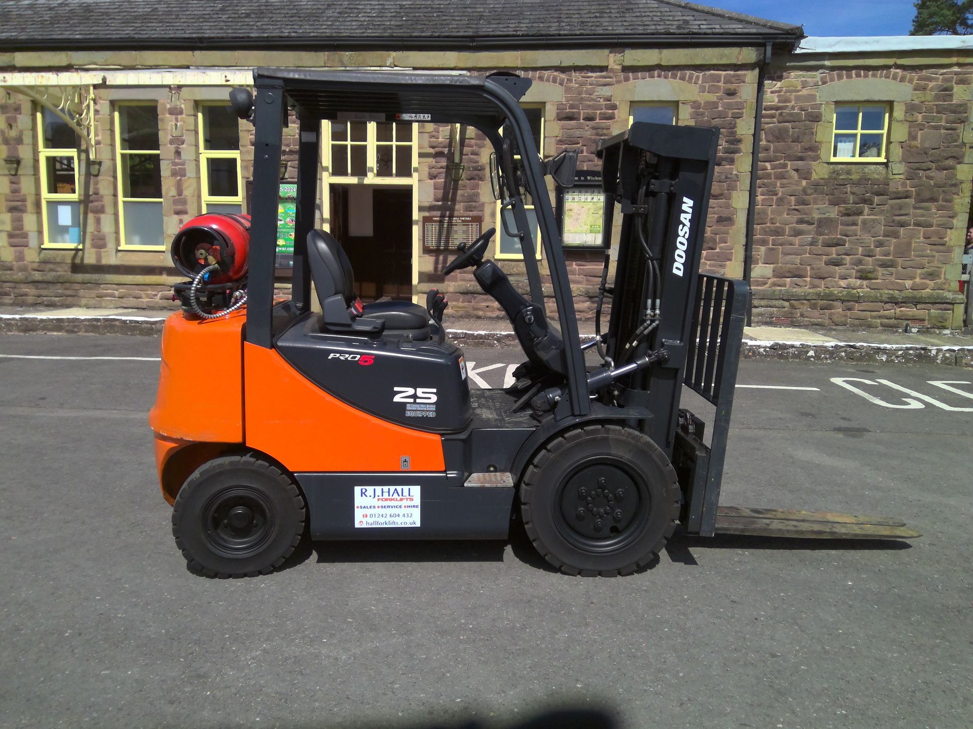 Orange forklift truck for hire or sale from RJ Hall Forklifts Hereford