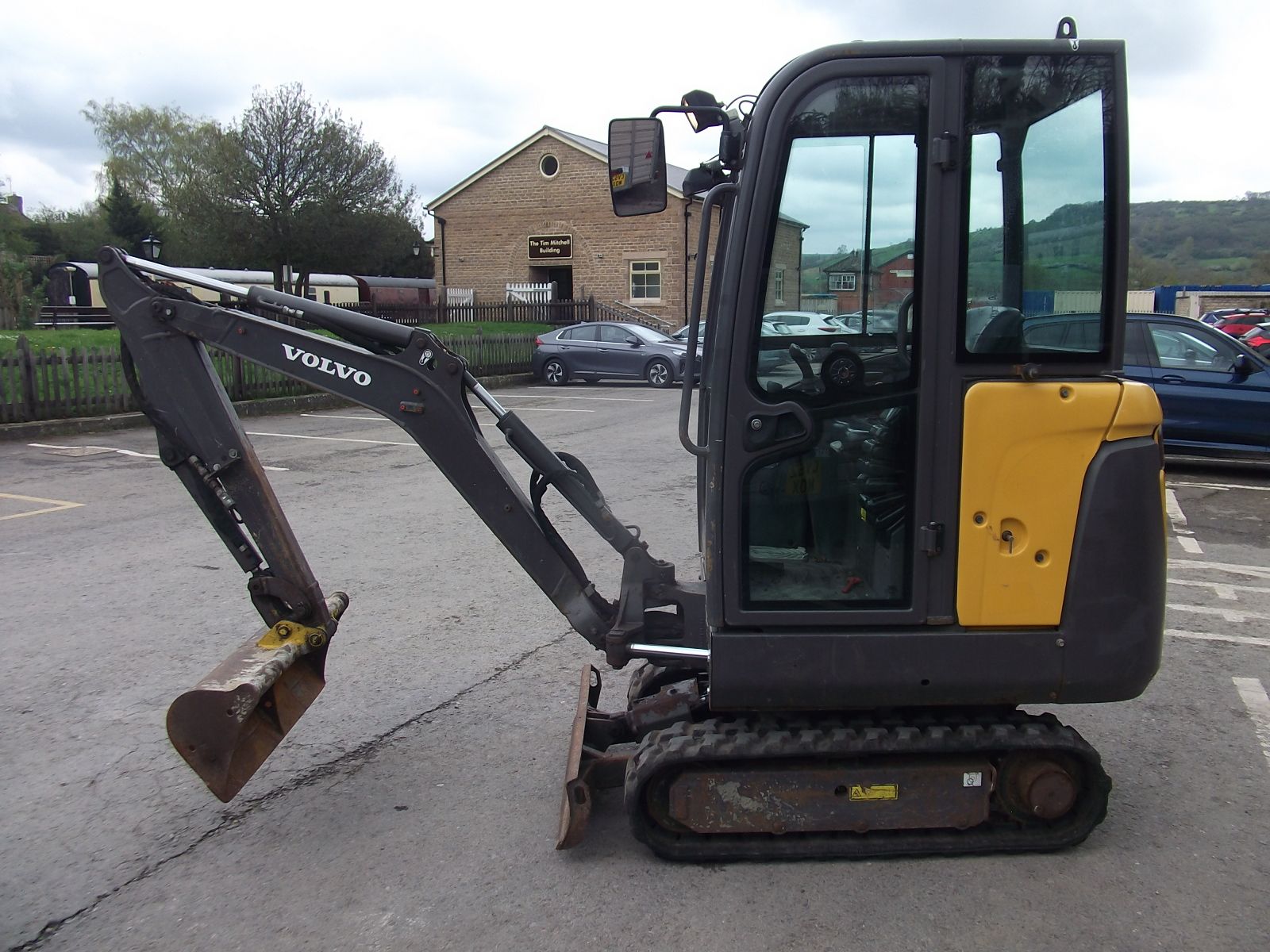 A volvo excavator is parked in a parking lot