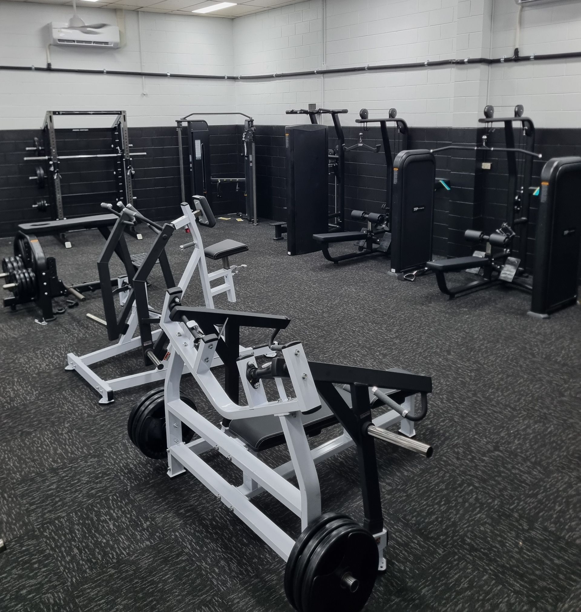 Three Treadmills Lined Up in a Gym With Tiled Floor — Ultimate Results Training in Aitkenvale, QLD