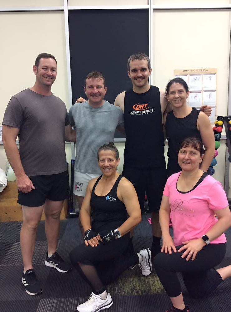 Five Groups Of People Are Posing For A Picture In A Gym — Ultimate Results Training in Aitkenvale, QLD