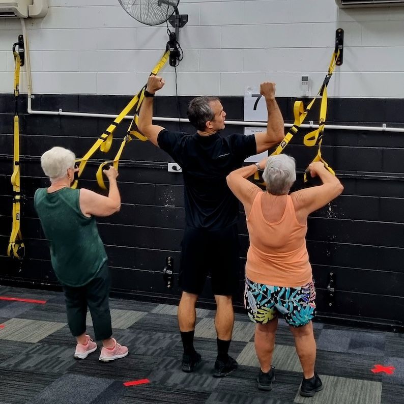 2 Older Ladies And Personal Trainer In A Gym — Ultimate Results Training in Aitkenvale, QLD