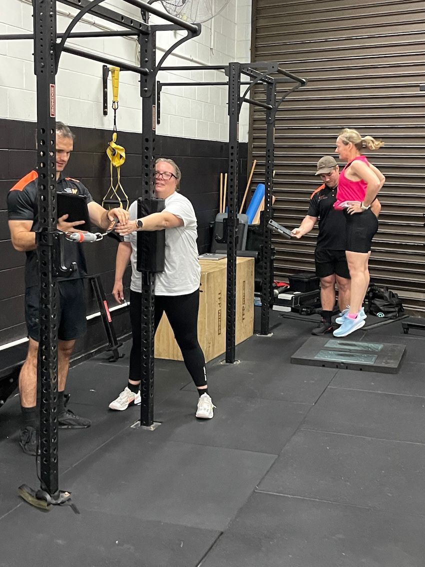 2 Personal Trainers With 2 Ladies Assisting With Rehabilitation — Ultimate Results Training in Aitkenvale, QLD