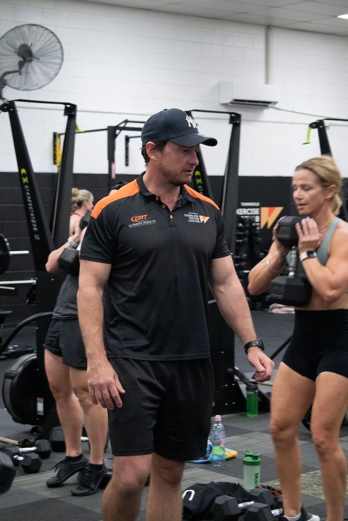 Personal Trainer Instructing Group Class In A Gym — Ultimate Results Training in Aitkenvale, QLD