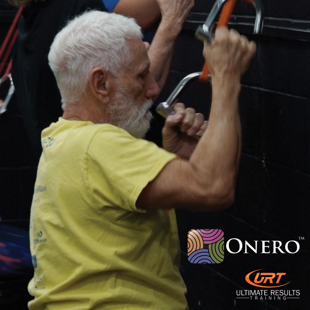 Man Exercising on a Machine, Pulling Handles — Ultimate Results Training in Aitkenvale, QLD