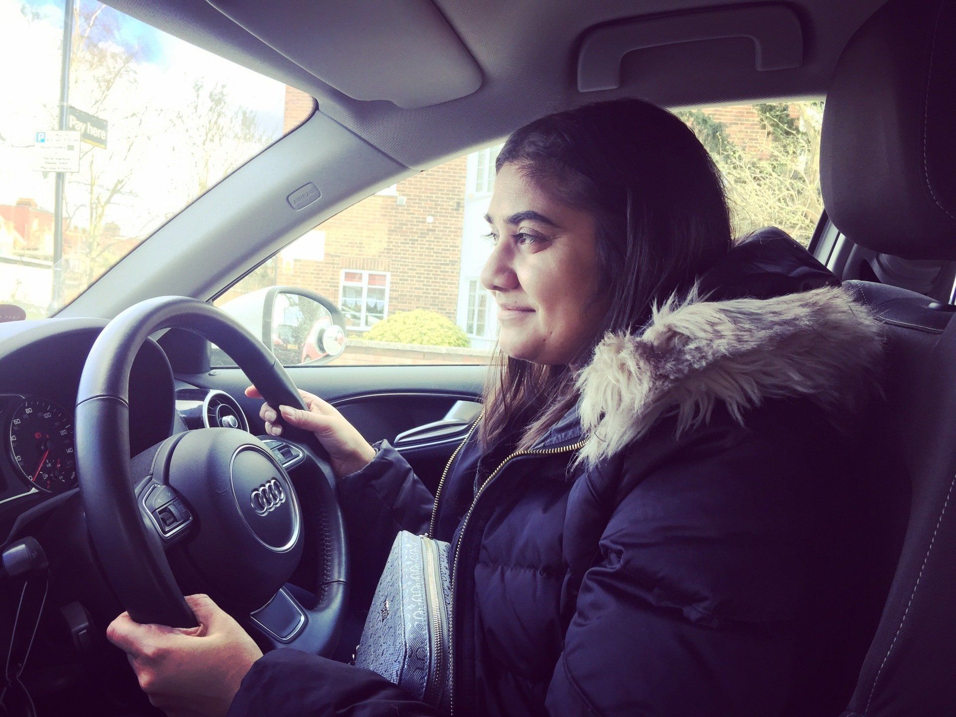 girl smiling driving