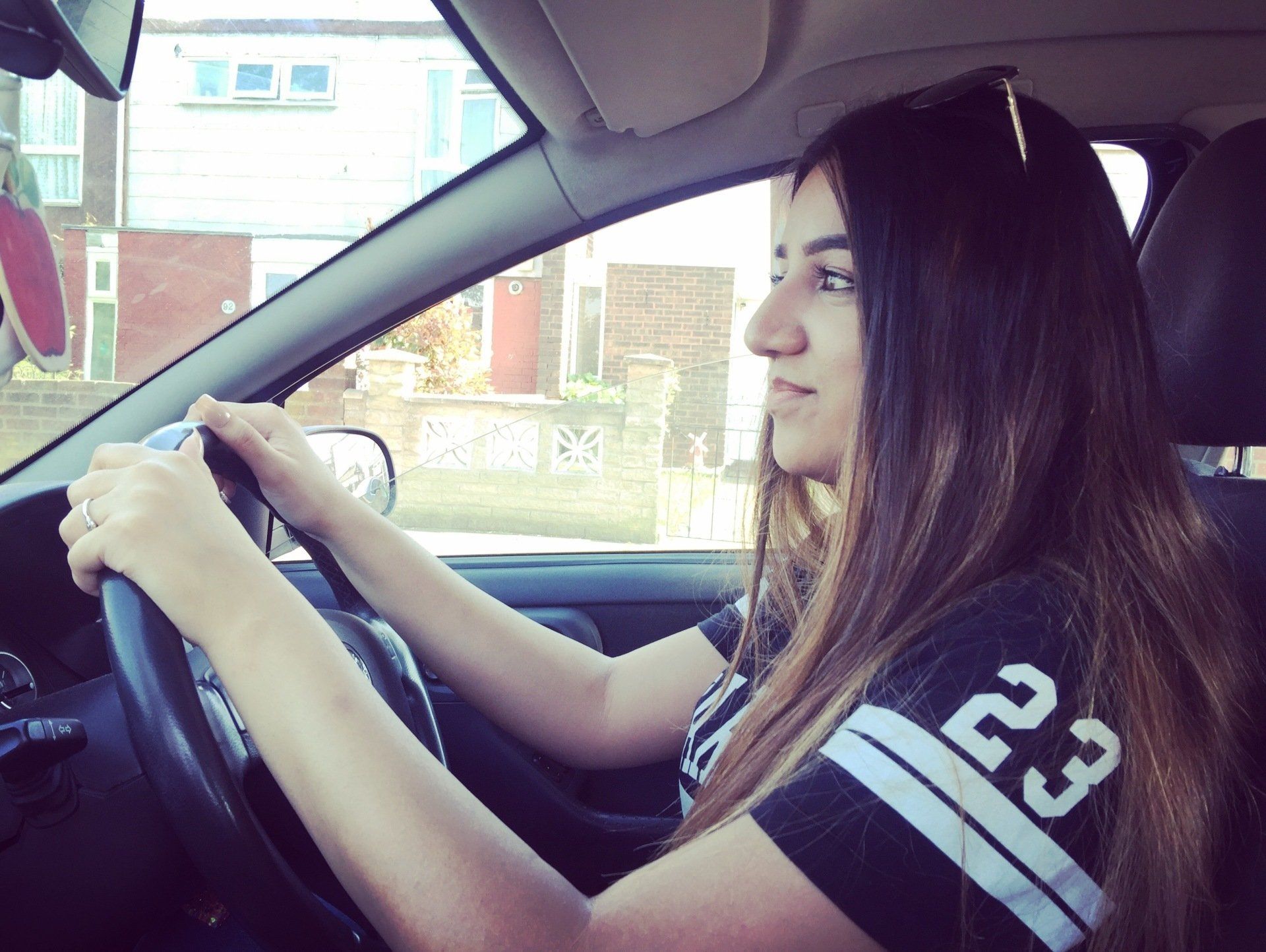 brunette woman driving