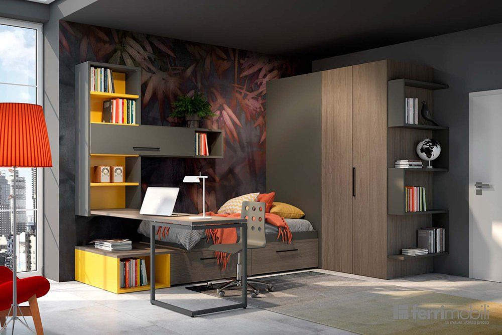 Una camera da letto con un letto e una scrivania con un computer portatile sopra