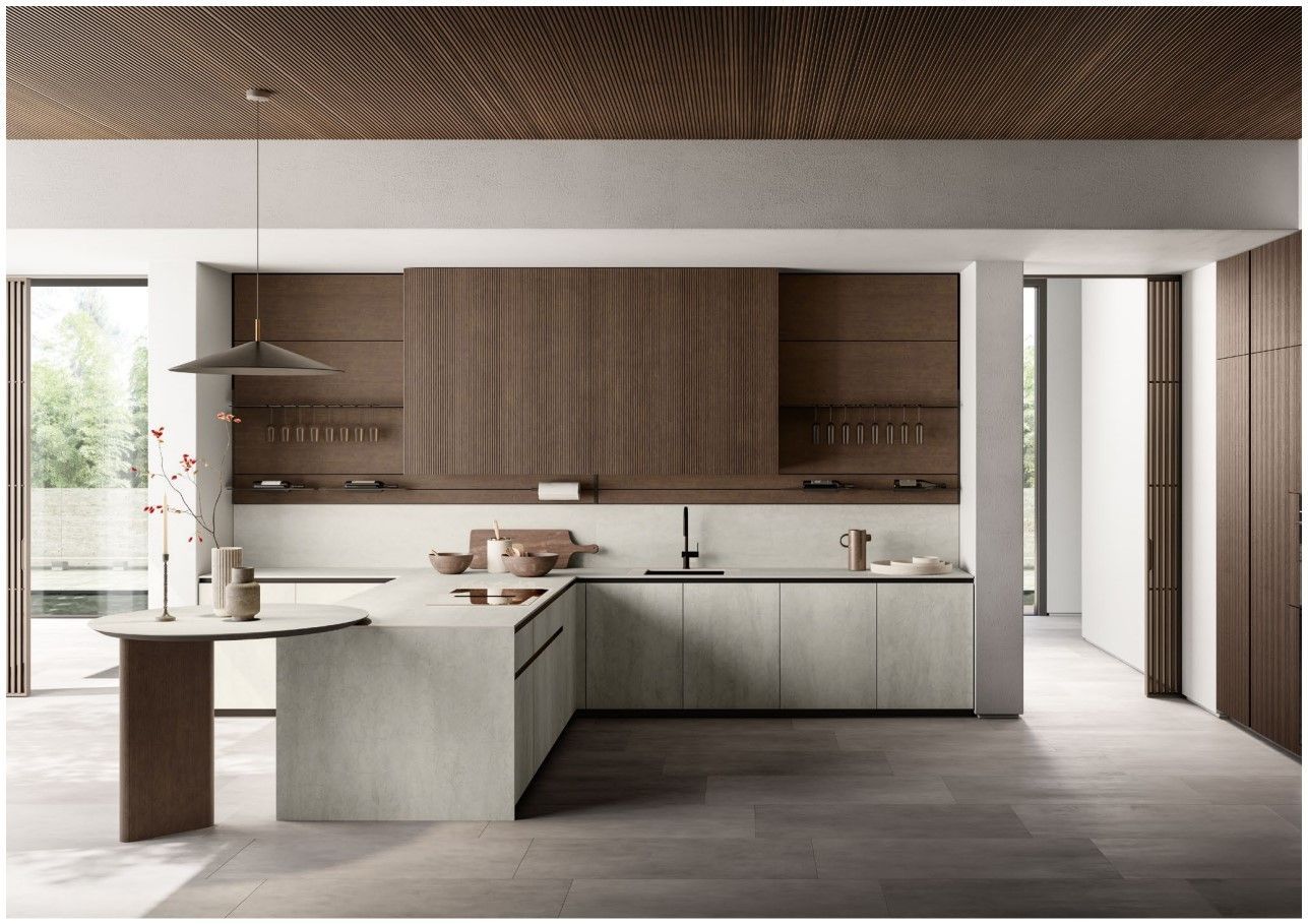 Una cucina con una grande isola al centro della stanza.