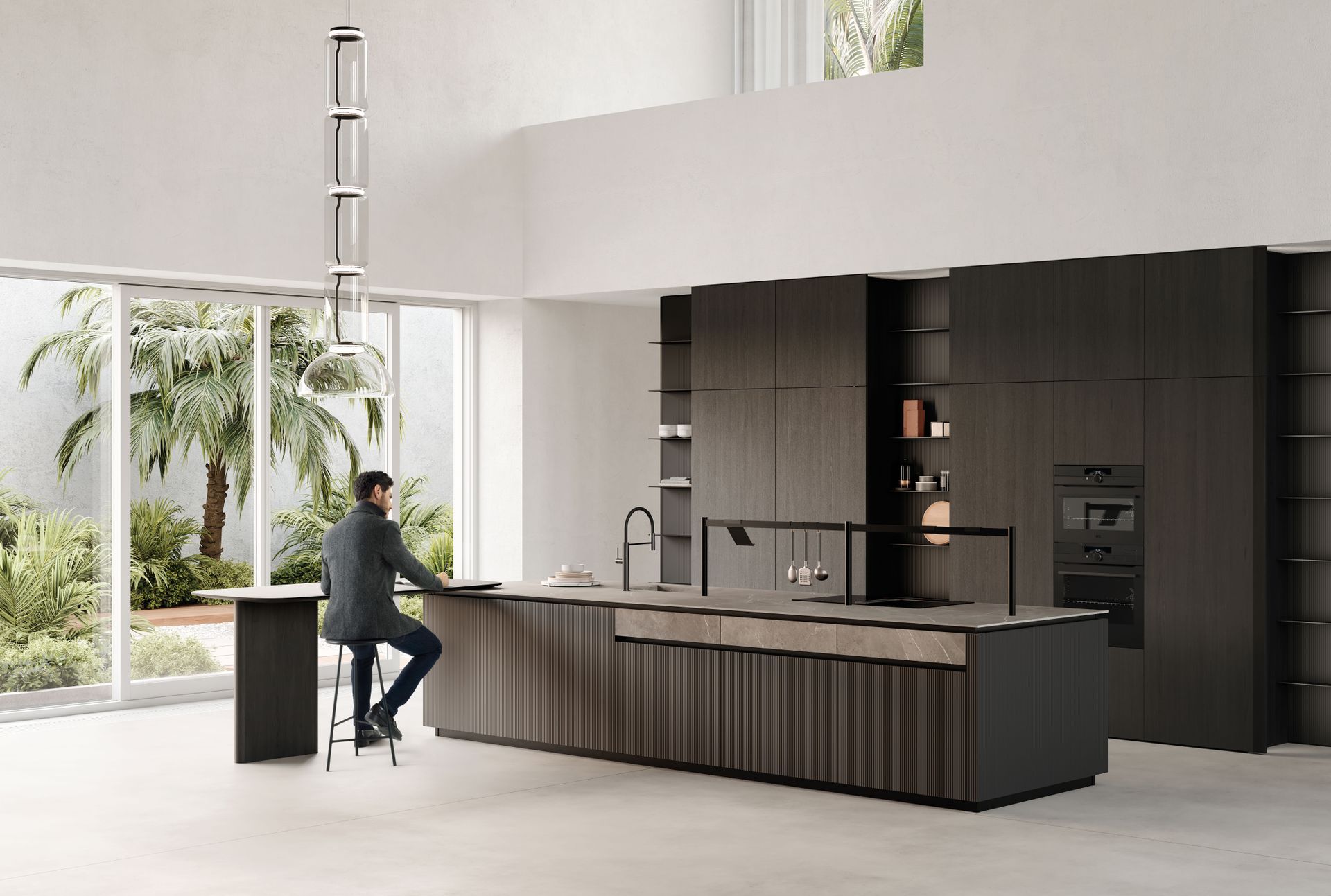 Un uomo è seduto al bancone di una cucina.