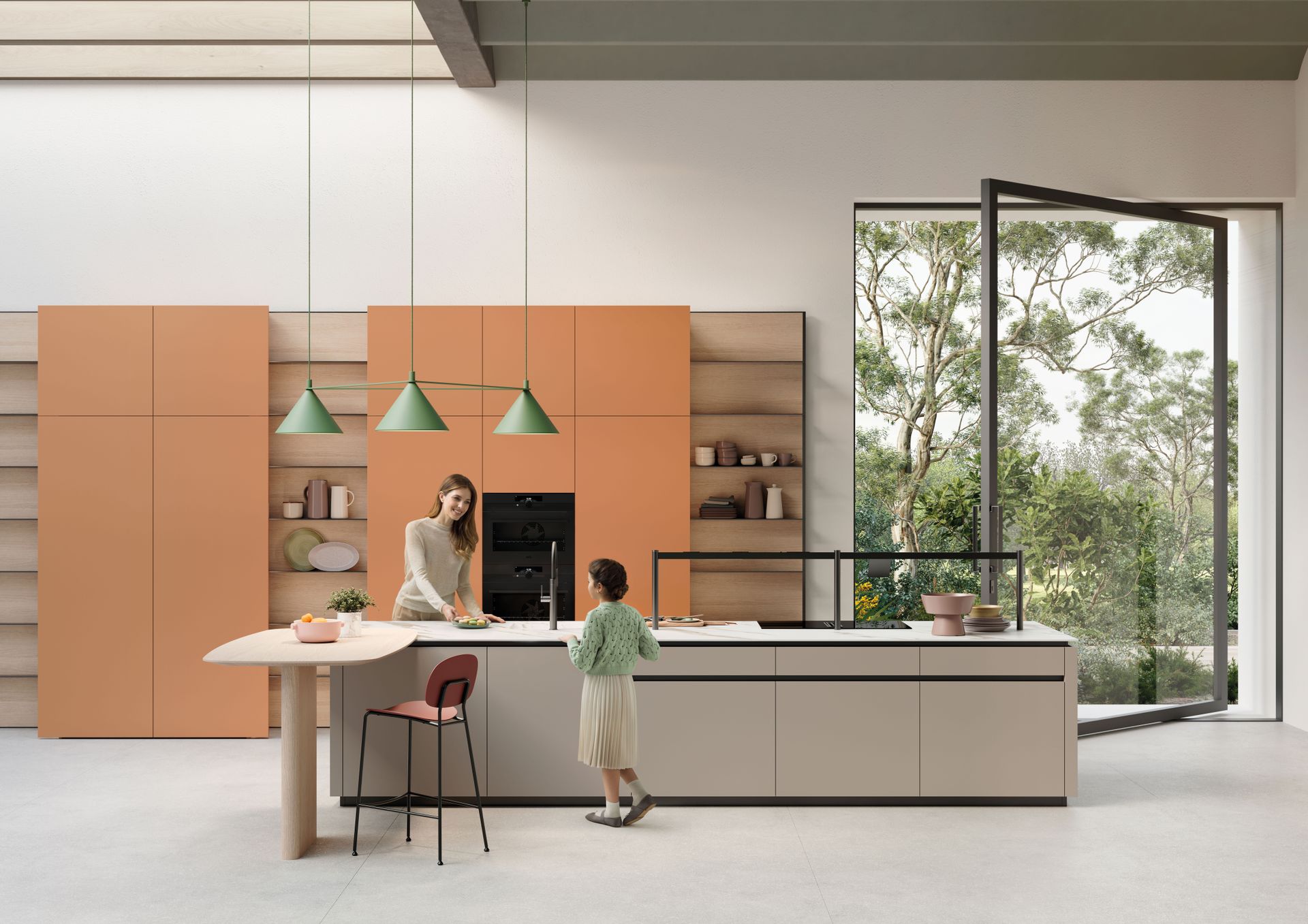 Una donna e un bambino sono in piedi in una cucina.