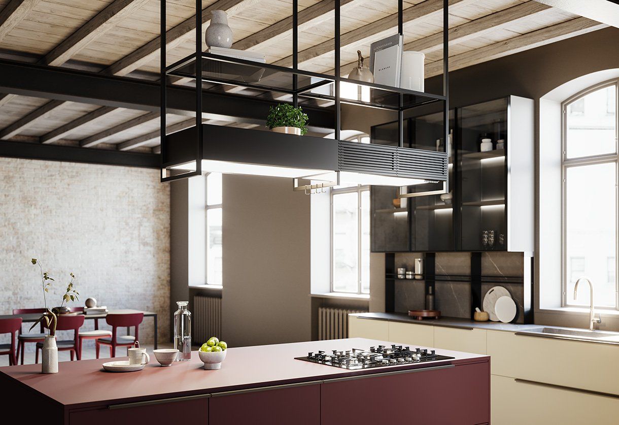 Una cucina con una grande isola e un piano cottura con forno.