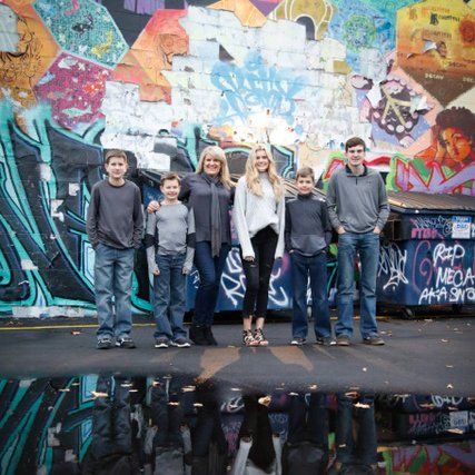 Owner's Family with Graffiti Wall on Background — Minneapolis, MN — Veterans Initiative