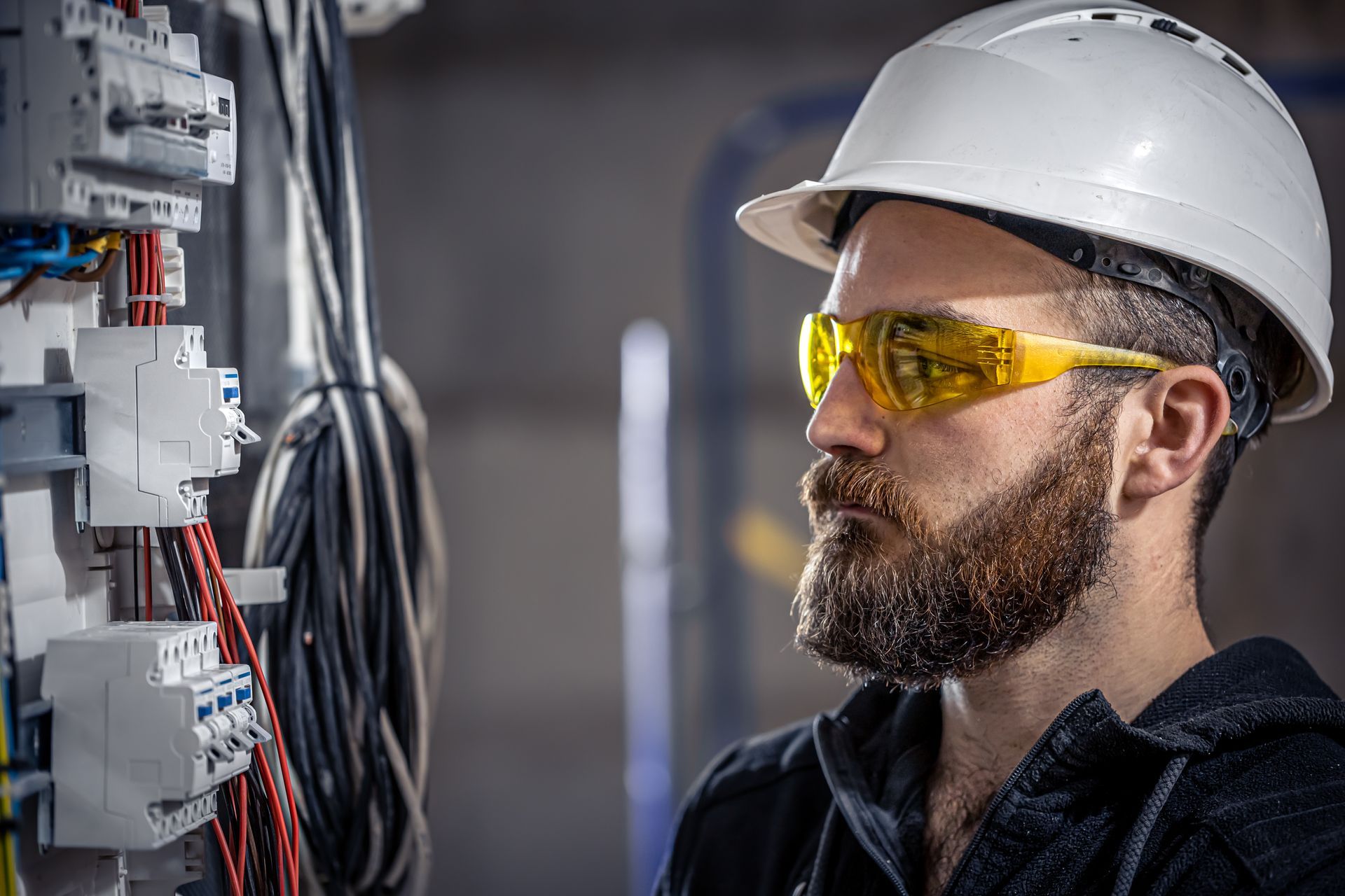 male-electrician-works-switchboard-with-electrical-connecting-cable+(3)-1920w.jpg