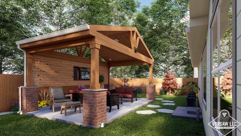 A backyard with a wooden pavilion and a brick building.