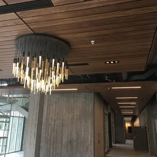 A long hallway with a chandelier hanging from the ceiling