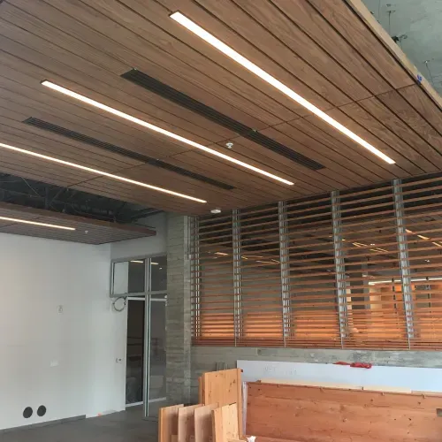 A room with a wooden ceiling and white walls