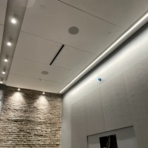 A room with a brick wall and a white ceiling