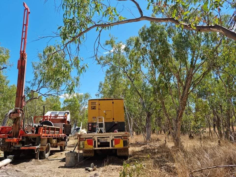 Two Trucks Parked In The Field — FNQ Drilling in Cairns, QLD