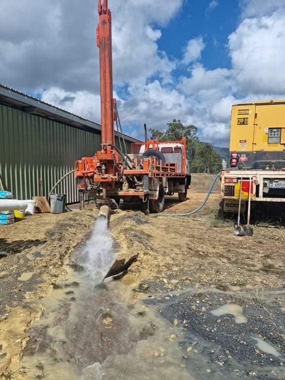 Truck With Water Bore Pumping Water — FNQ Drilling in Bamboo, QLD