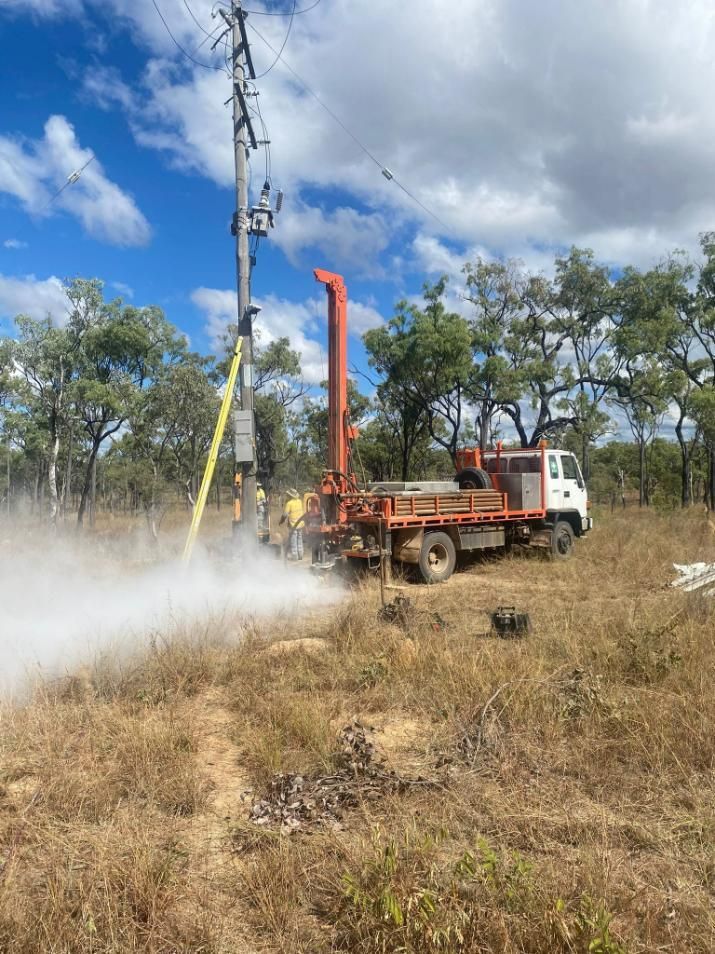 Truck Is Drilling A Hole In The Ground In A Field — FNQ Drilling in Bamboo, QLD