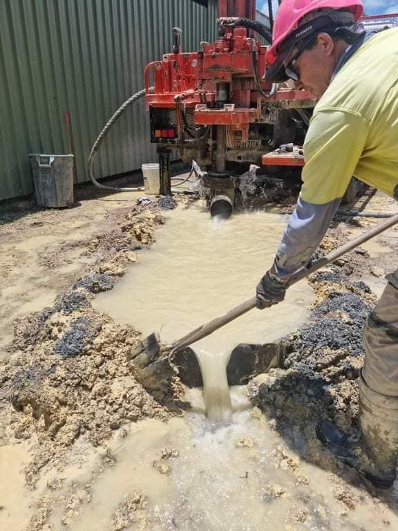 Man Is Using A Machine To Drill A Hole In The Ground — FNQ Drilling in Cairns, QLD