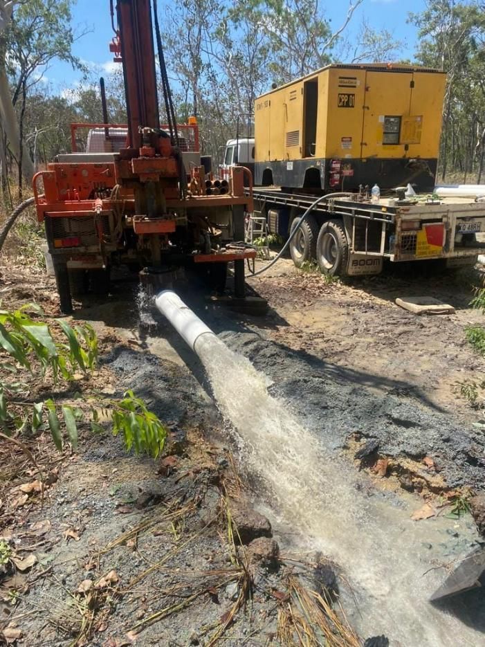 Truck Is Pumping Water From A Pipe Into A Field — FNQ Drilling in Bamboo, QLD