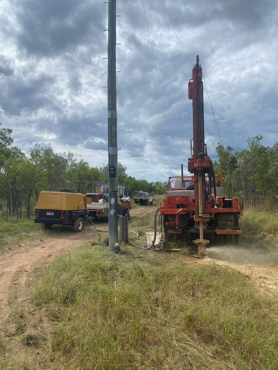 A Machine Is Drilling A Hole In The Ground In A Field — FNQ Drilling in Georgetown, QLD