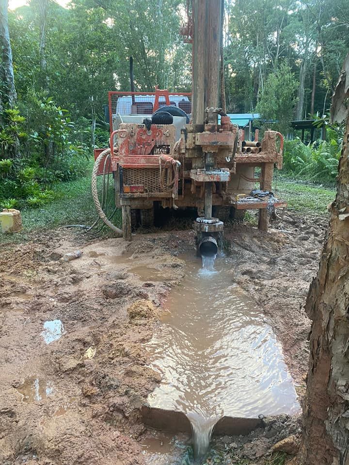 Drilling Rig at Work, Splashing Water and Mud on the Ground — FNQ Drilling in Babinda, QLD