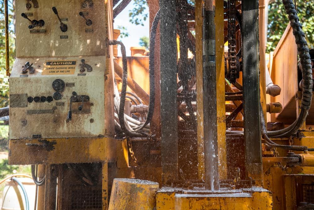 A Close Up of a Machine With Water Coming Out of It — FNQ Drilling in Innisfail, QLD