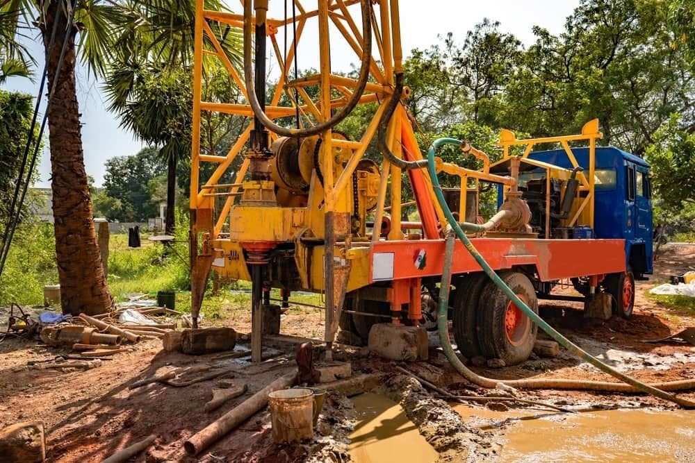 A Truck is Being Used to Drill a Hole in the Ground — FNQ Drilling in Innisfail, QLD