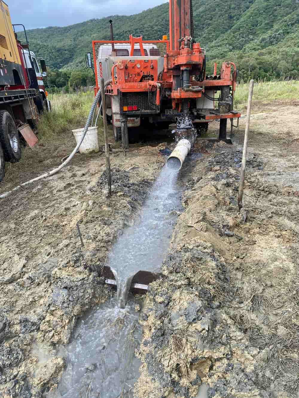 A Truck is Pumping Water From a Pipe Into a Field — FNQ Drilling in Tully, QLD