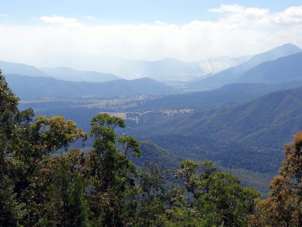 A View of a Mountain Range With Trees in the Foreground — FNQ Drilling in Innisfail, QLD