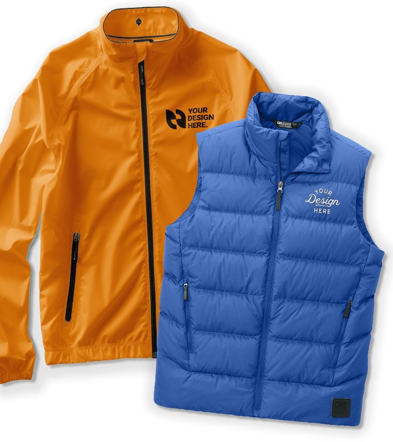 A blue hoodie and a black sweatshirt are on a wooden table