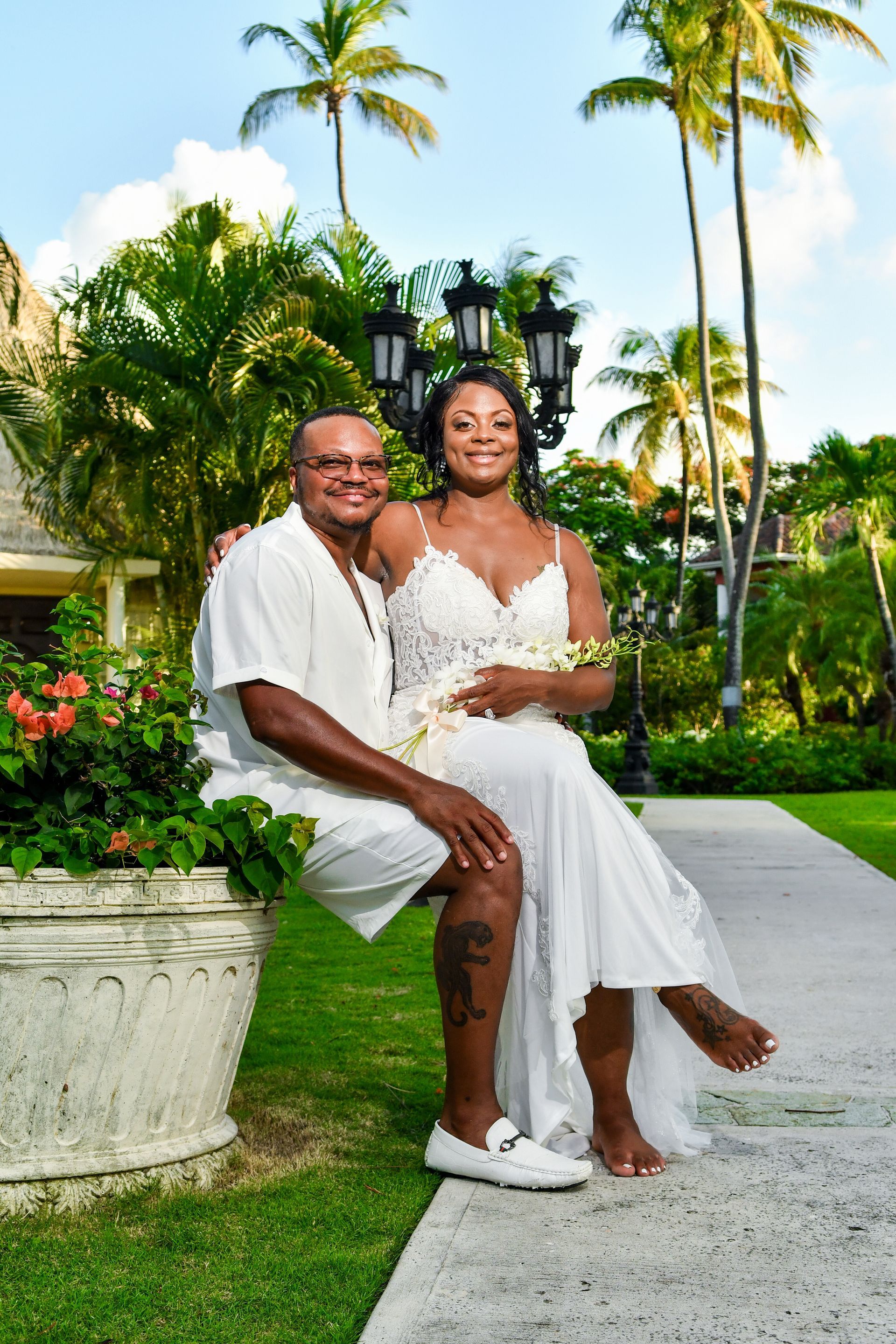 A man is holding a woman in his arms while they pose for a picture.