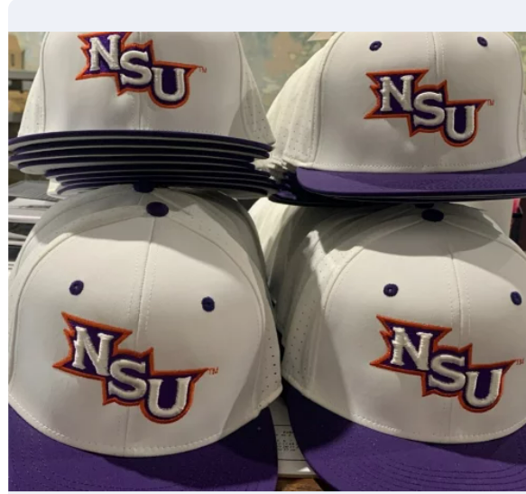 A bunch of nsu hats are stacked on top of each other