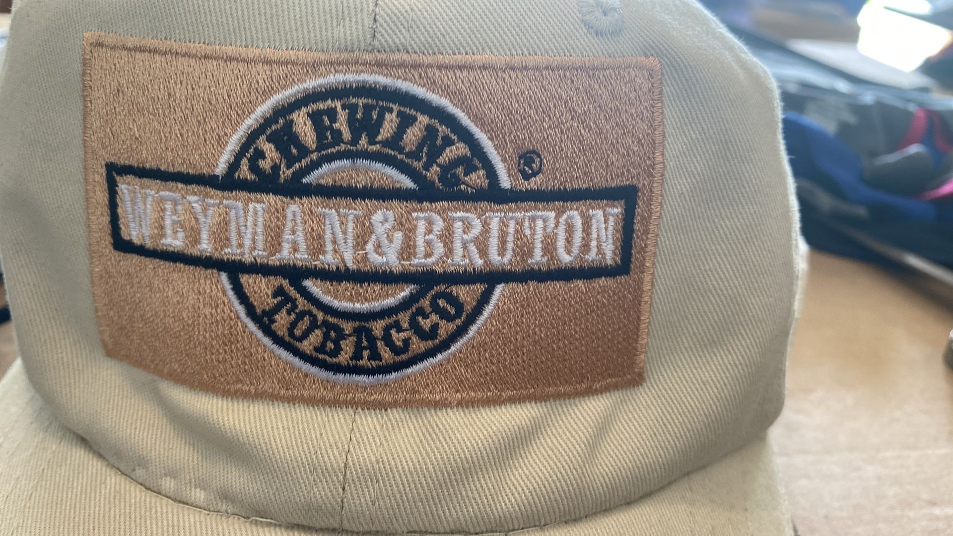 A baseball cap that says heyman & bruton tobacco on it