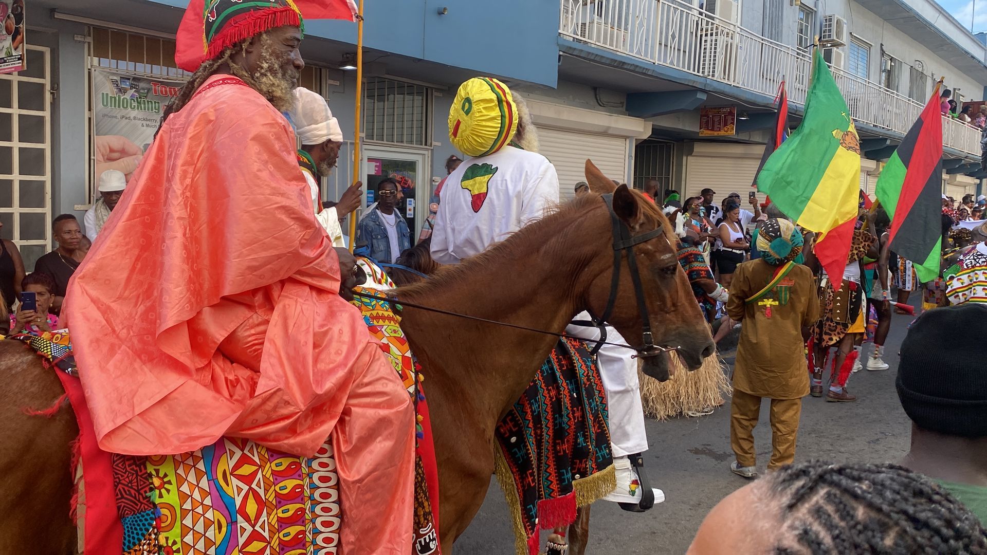 A group of people are riding horses in a parade.