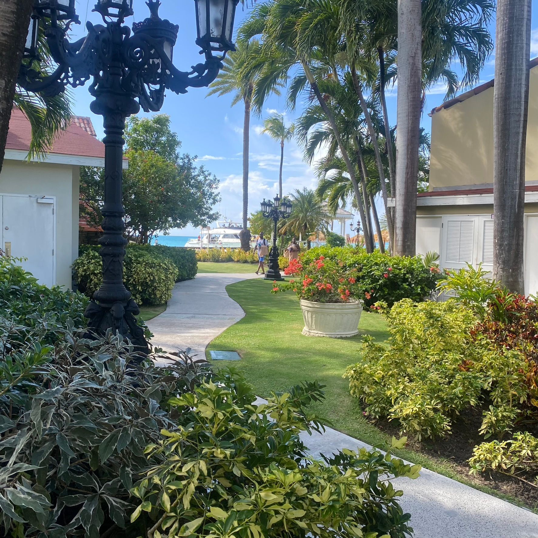 A walkway with a lamp post in the middle of it