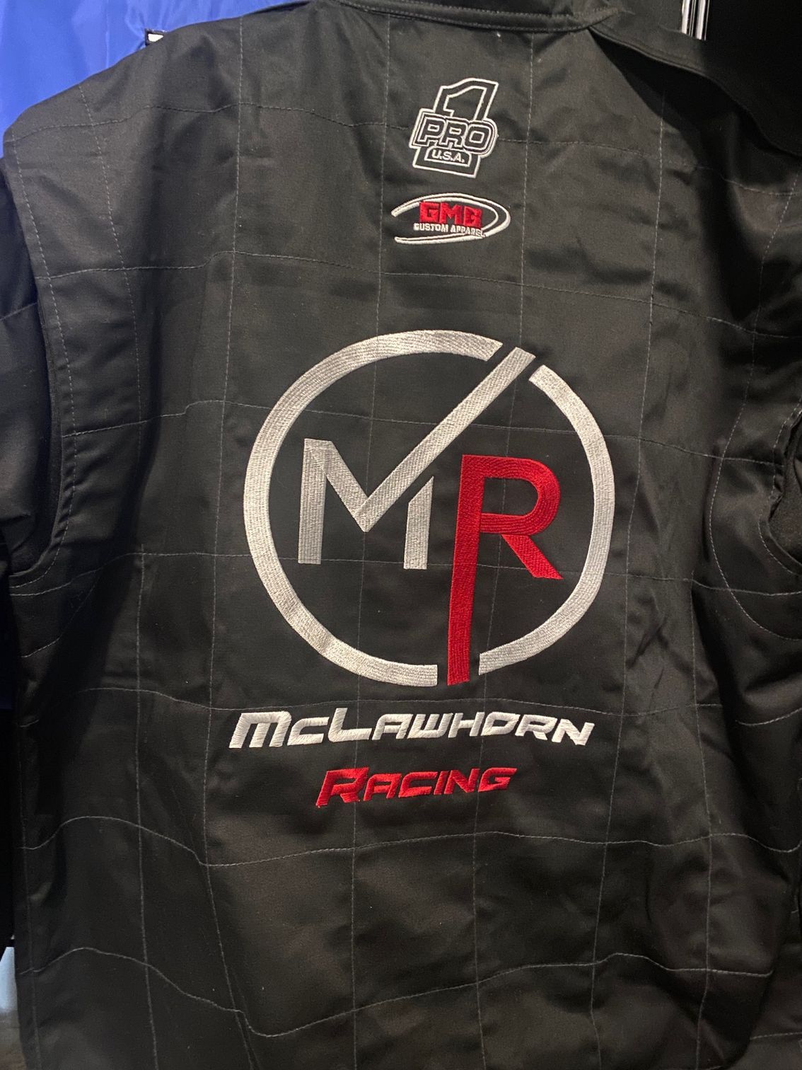 The back of a mclawhorn racing jacket