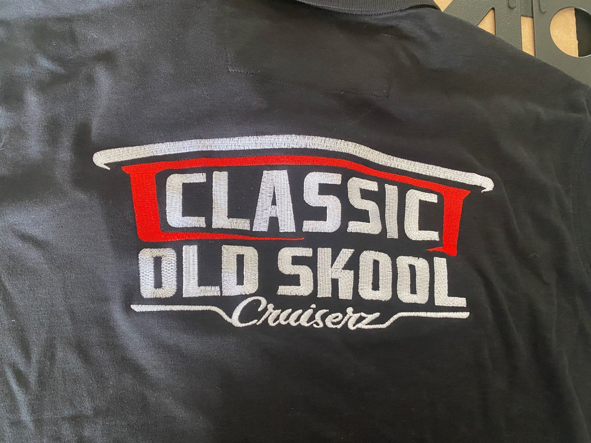 A black shirt that says classic old skool cruiserz