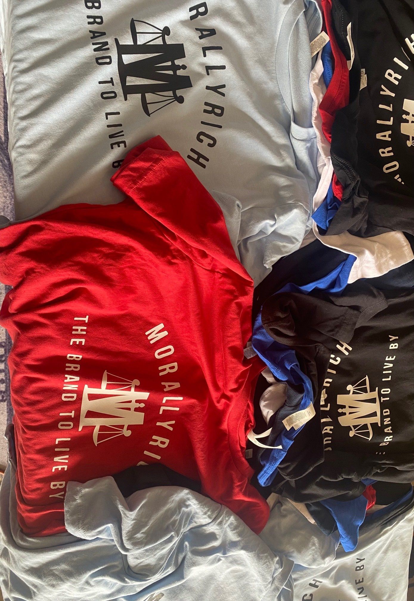 A bunch of t-shirts are stacked on top of each other