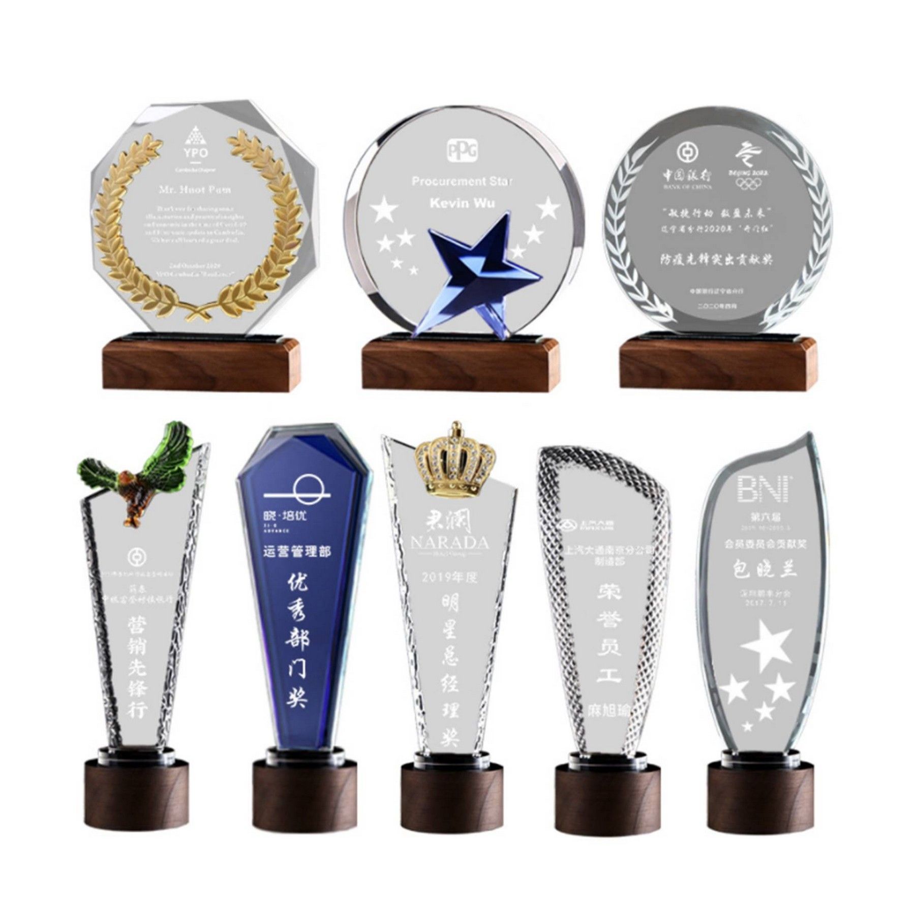 A variety of trophies are lined up on a white background.