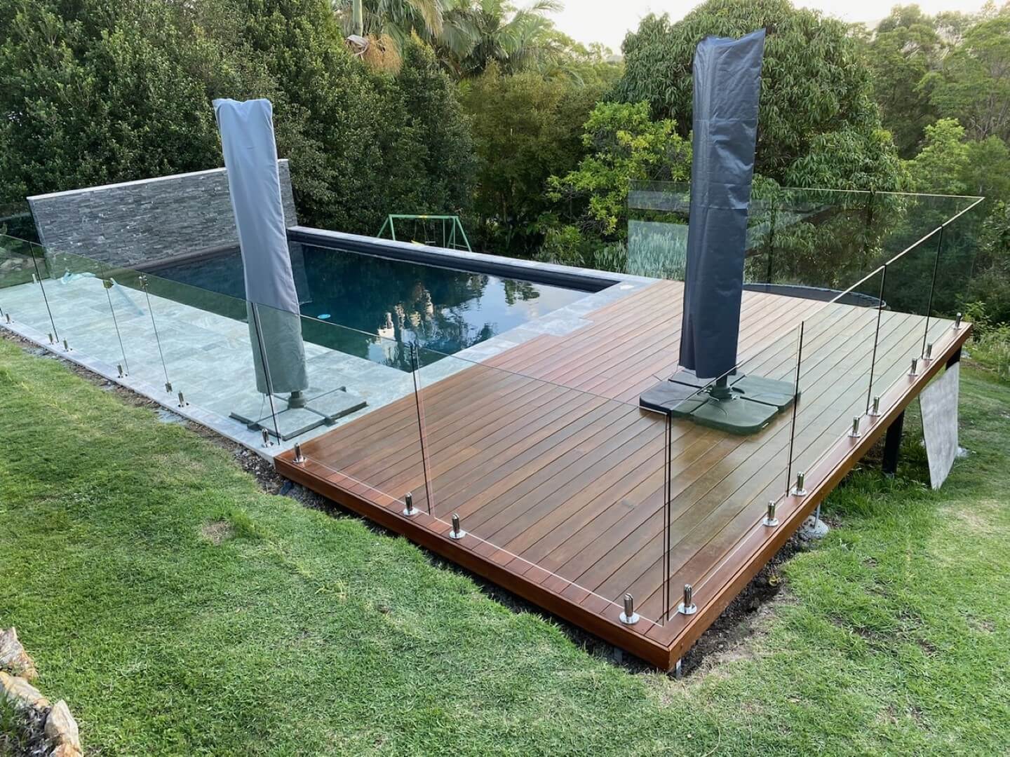 Pool Surrounds with Decking and Glass Pool Fencing
